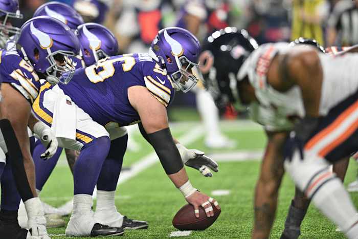 Nov 27, 2023; Minneapolis, Minnesota, USA; Minnesota Vikings center Garrett Bradbury (56) gets ready to snap the ball against the Chicago Bears during the second quarter at U.S. Bank Stadium.